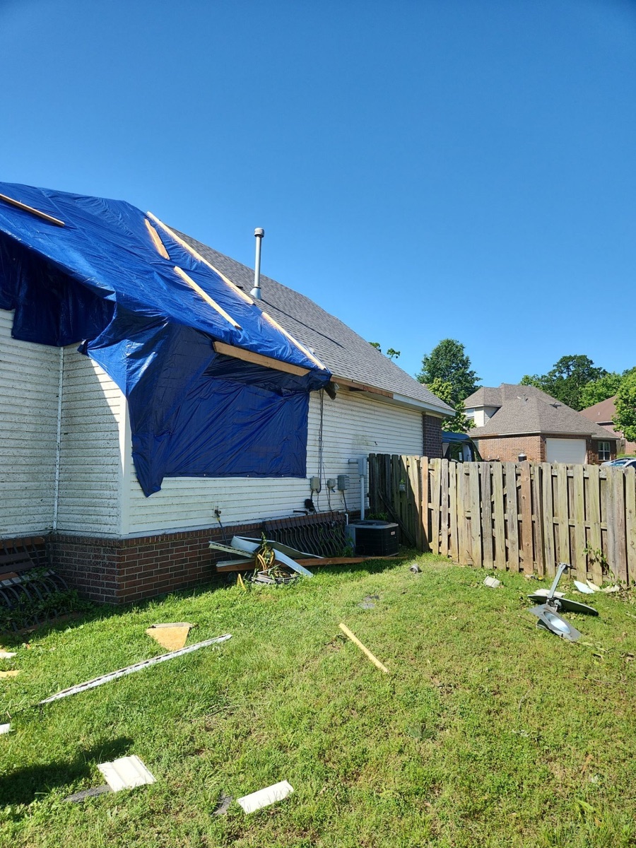 Tarped residence post storm in Northwest Arkansas, awaiting environmental triage